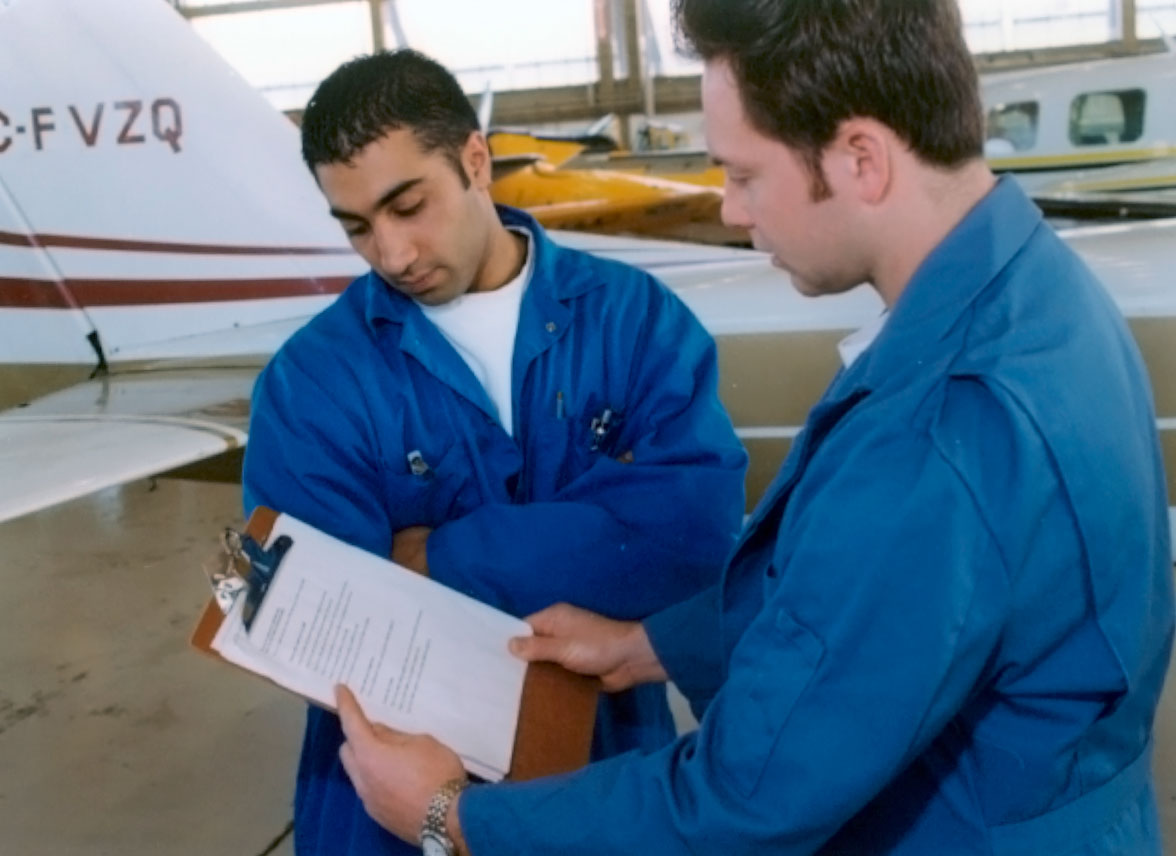 A picture of an intern and his supervisor.